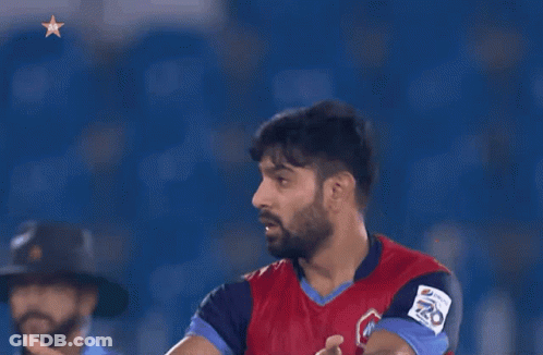 A Man In A Red And Blue Jersey With The Number 20 On It GIF