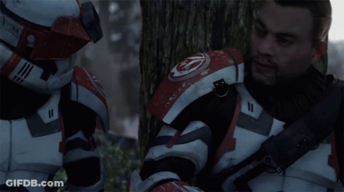 A Man In A Red And White Armor With The Number 11 On His Chest GIF