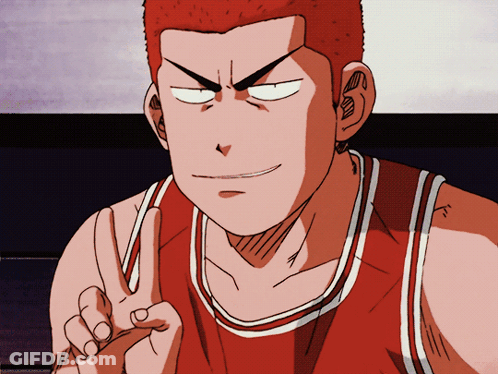 A Man In A Red And White Basketball Jersey Giving A Peace Sign GIF