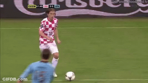 A Man In A Red And White Checkered Shirt With The Number 10 On It GIF