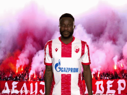 A Man In A Red And White Gazprom Jersey GIF