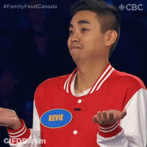 A Man In A Red And White Jacket Has A Name Tag That Says Revie GIF