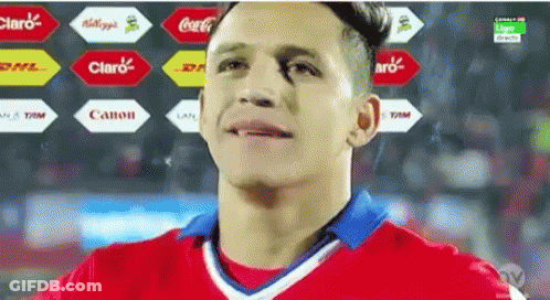 A Man In A Red And White Jersey With A Coca Cola Logo In The Background GIF