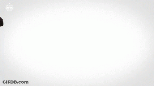A Man In A Red And White Striped Red Bull Jersey GIF
