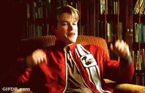 A Man In A Red And White Striped Shirt Is Sitting In A Chair With His Arms Outstretched . GIF