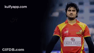 A Man In A Red And Yellow Jersey With The Word Pride India On It GIF