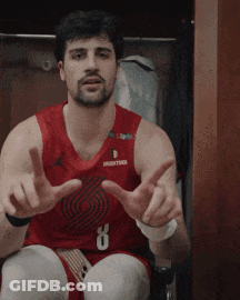 A Man In A Red Basketball Jersey With The Number 8 On It GIF