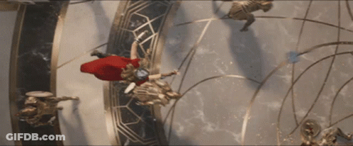 A Man In A Red Cape Is Flying Through A Circle GIF
