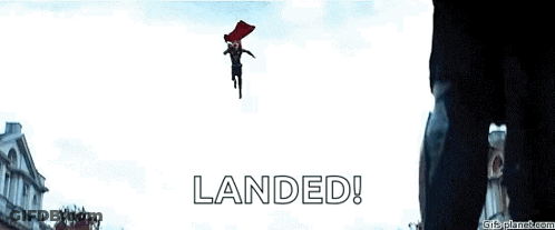 A Man In A Red Cape Is Flying Through The Air With The Words Landed Written Below Him . GIF