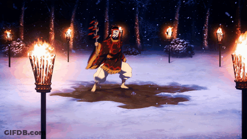 A Man In A Red Cape Is Holding A Torch In The Snow GIF