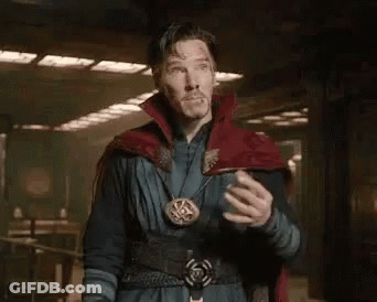 A Man In A Red Cape Is Standing In A Room With His Hands On His Chest And Says Doctor Stephen Strange . GIF