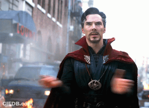 A Man In A Red Cape Is Standing In Front Of A Building With The Word Lounge On It GIF