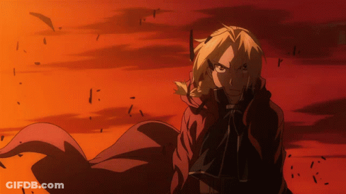 A Man In A Red Cape Is Standing In Front Of A Red And Orange Background GIF