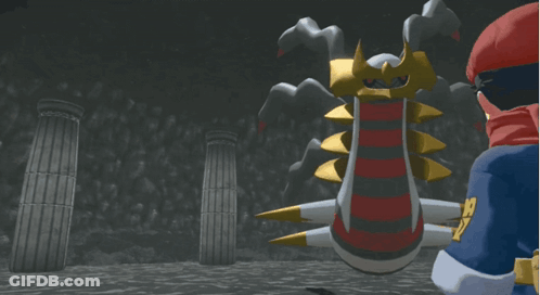 A Man In A Red Cape Stands In Front Of A Giant Monster GIF