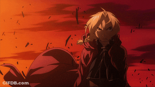 A Man In A Red Cape Stands In Front Of A Red And Orange Background GIF