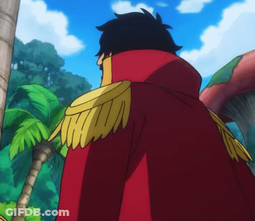 A Man In A Red Cape With Gold Epaulettes GIF