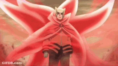A Man In A Red Cape With Wings Is Standing In A Field . GIF