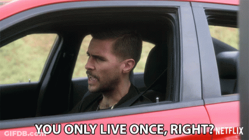 A Man In A Red Car Says " You Only Live Once Right ? " GIF