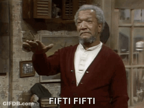 A Man In A Red Cardigan Says Fifti Fifti In Front Of A Window GIF