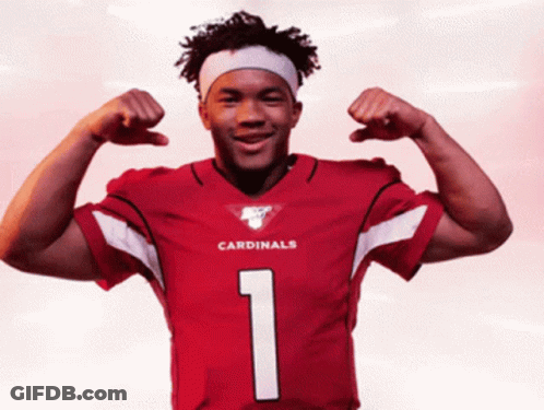 A Man In A Red Cardinals Jersey Flexes His Arms GIF
