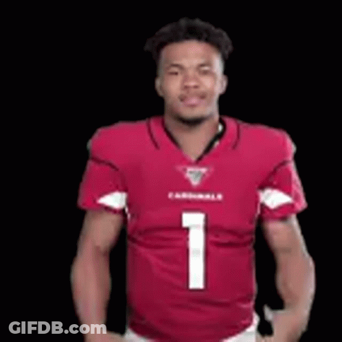 A Man In A Red Cardinals Jersey Is Giving A Thumbs Up Sign . GIF