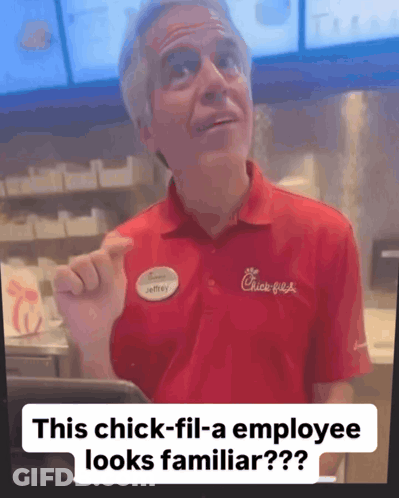 A Man In A Red Chick-Fil-A Shirt Is Pointing At Something GIF
