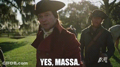 A Man In A Red Coat Says Yes Massa On A Screen GIF