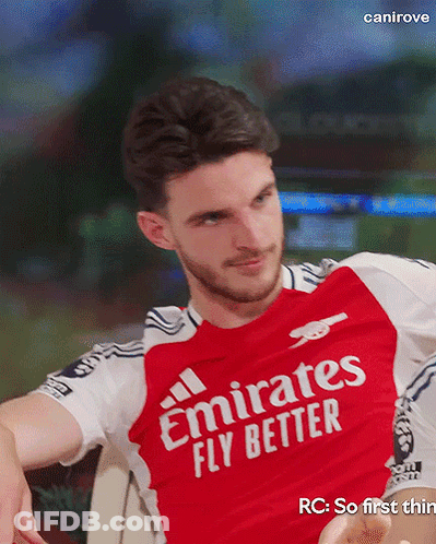 A Man In A Red Emirates Fly Better Shirt GIF