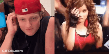 A Man In A Red Hat And A Woman In A Red Shirt GIF