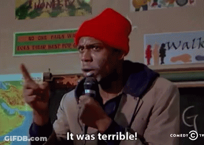 A Man In A Red Hat Is Holding A Microphone And Says It Was Terrible GIF