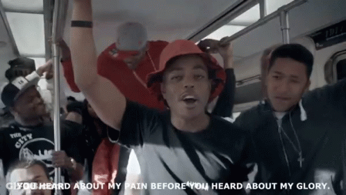 A Man In A Red Hat Is Riding A Subway With The Words You Heard About My Pain Before You Heard About My Glory GIF