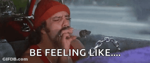 A Man In A Red Hat Is Smoking A Cigarette In A Car And The Words `` Be Feeling Like '' Are Above Him . GIF