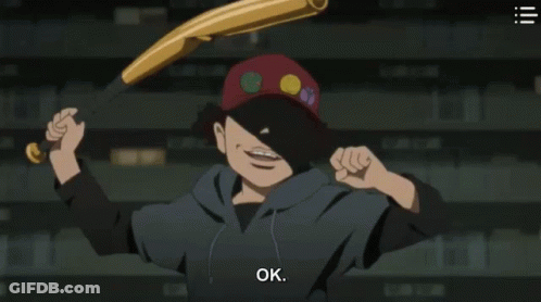 A Man In A Red Hat Is Standing In Front Of A Shelf With Books . GIF