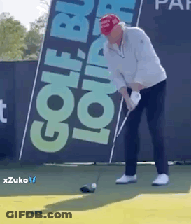 A Man In A Red Hat Is Swinging A Golf Club On A Golf Course . GIF