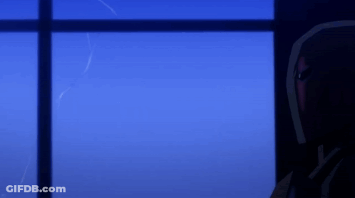 A Man In A Red Helmet Looks Out A Window At Night GIF