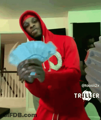 A Man In A Red Hoodie Holds A Fan Of Money GIF