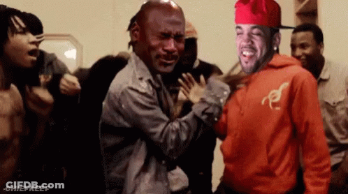 A Man In A Red Hoodie Is Standing Next To A Man In A Grey Jacket GIF