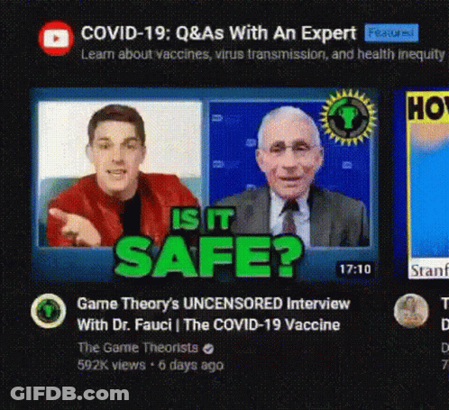 A Man In A Red Jacket And A Man In A Suit Are Sitting Next To Each Other On A Video Screen . GIF