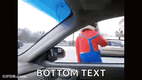 A Man In A Red Jacket And Blue Overalls Is Standing In A Car With The Words Bottom Text Written Below Him GIF
