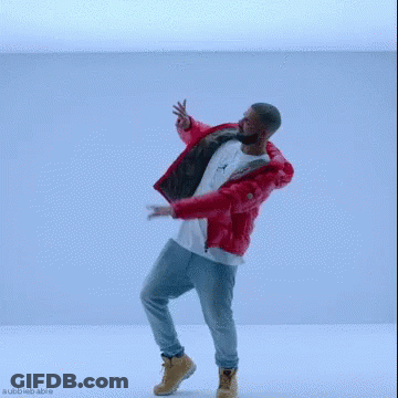 A Man In A Red Jacket And Jeans Is Dancing In A Blue Room . GIF