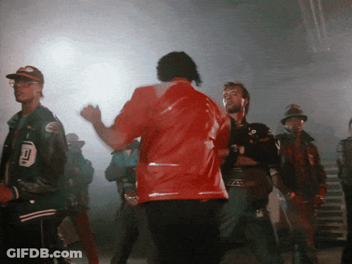 A Man In A Red Jacket Has The Number 10 On His Back GIF