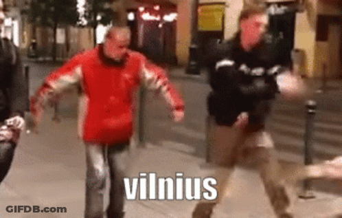 A Man In A Red Jacket Is Dancing On A Sidewalk With The Word Vilnius Written On The Bottom . GIF