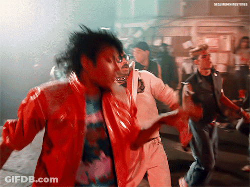 A Man In A Red Jacket Is Dancing With A Man In A White Shirt And A Man In A Black Jacket GIF