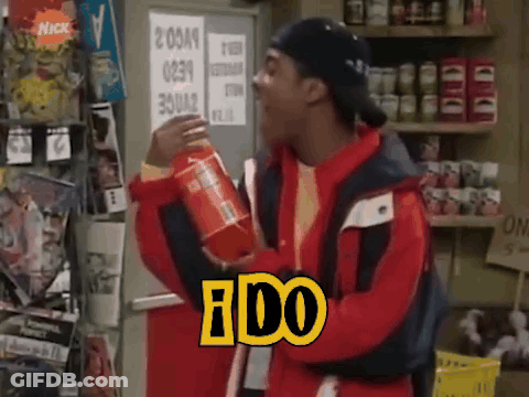 A Man In A Red Jacket Is Holding A Can Of Soda With The Word Ido On It GIF