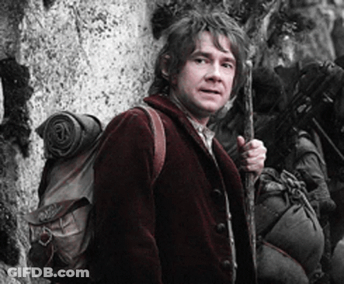 A Man In A Red Jacket Is Holding A Cane And A Backpack GIF