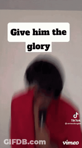 A Man In A Red Jacket Is Holding A Microphone In Front Of His Face And Says `` Give Him The Glory '' . GIF
