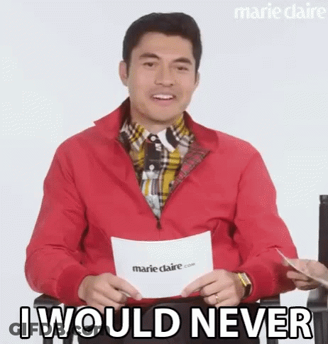 A Man In A Red Jacket Is Holding A Piece Of Paper And Saying `` I Would Never '' While Sitting Down . GIF
