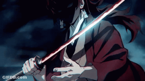 A Man In A Red Jacket Is Holding A Sword In His Hands . GIF
