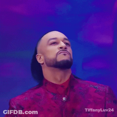 A Man In A Red Jacket Is Holding A Trophy With Tiffanyluv24 On The Bottom Right GIF