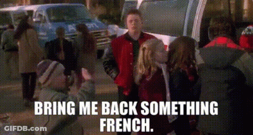 A Man In A Red Jacket Is Shaking Hands With A Girl In A Red Jacket . GIF